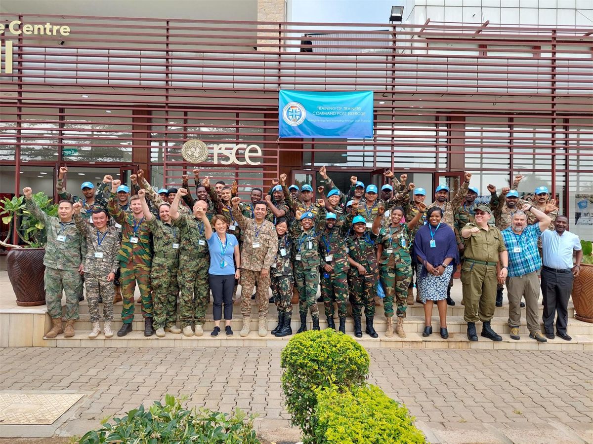 UN personnel and staff gathered outside a field centre